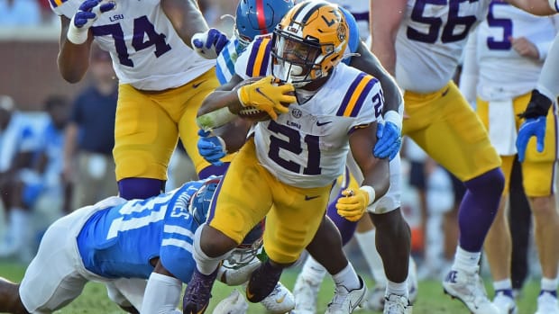 Oct 23, 2021; Oxford, Mississippi, USA; LSU Tigers running back Corey Kiner (21) carries the ball during the second half against the Mississippi Rebels at Vaught-Hemingway Stadium. Mandatory Credit: Justin Ford-USA TODAY Sports